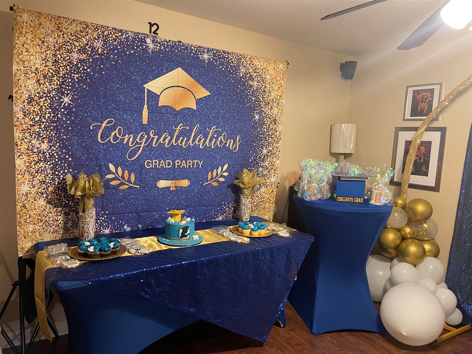 Graduation dessert table with cake and cupcakes