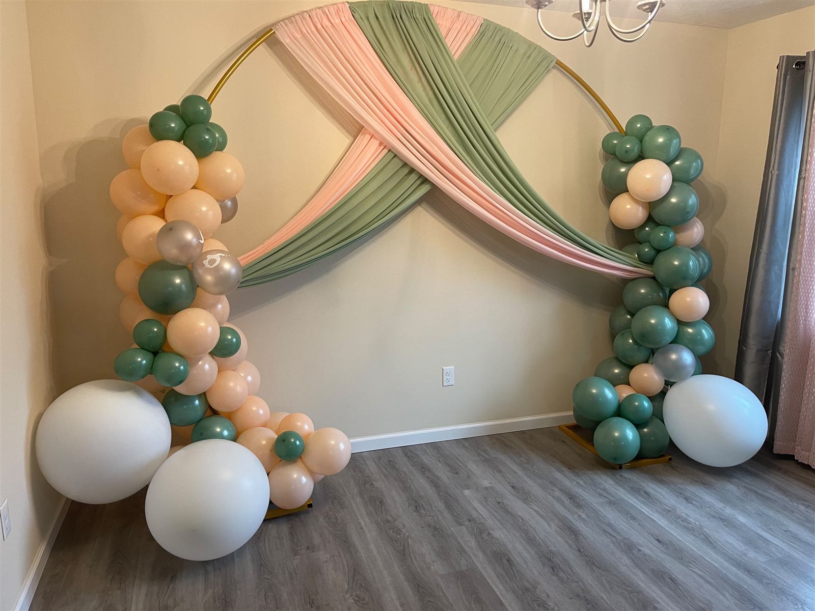 Sage and blush draped balloon arch