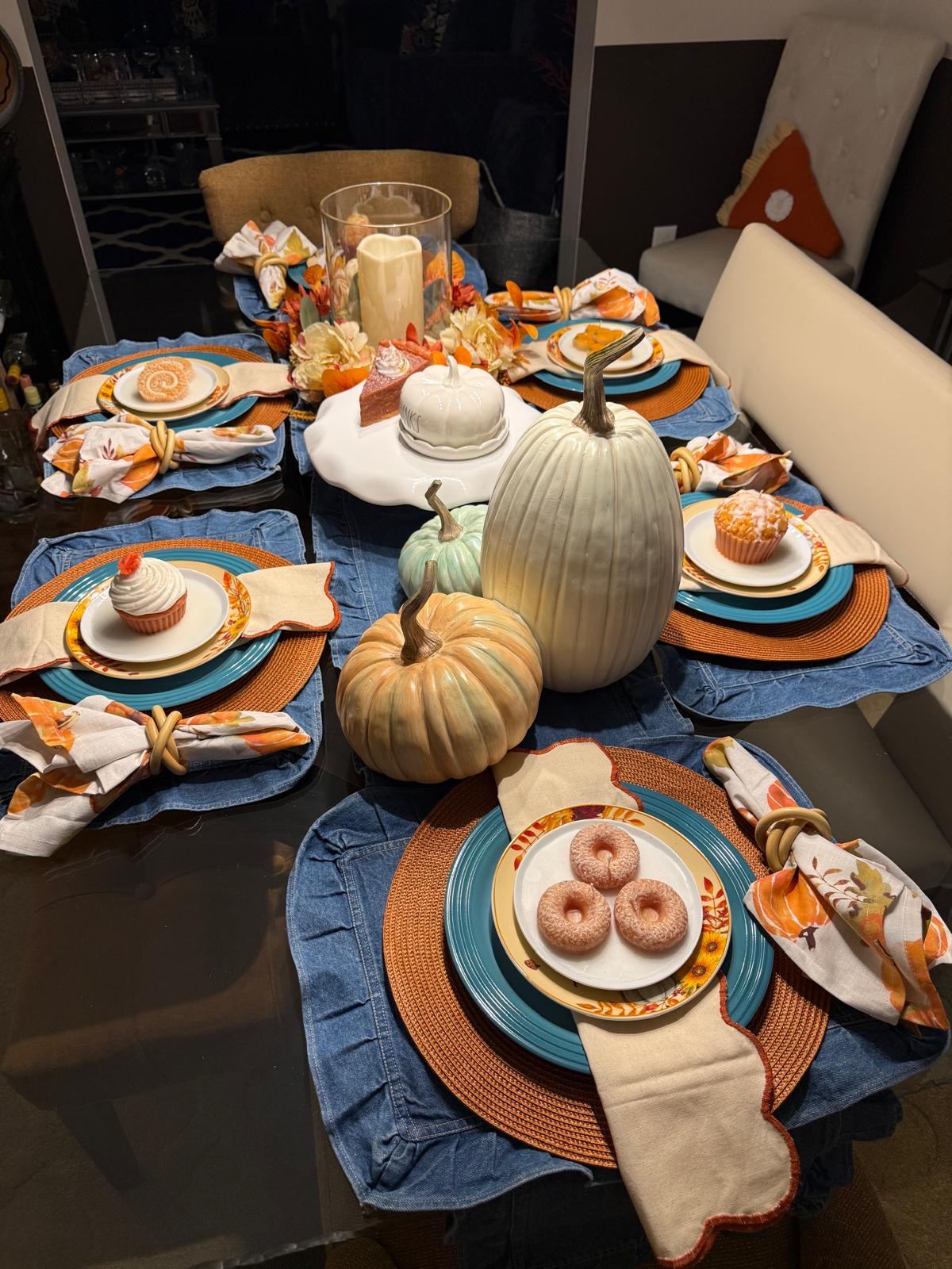 Denim and teal fall table with pumpkins, donuts, and pillar candles