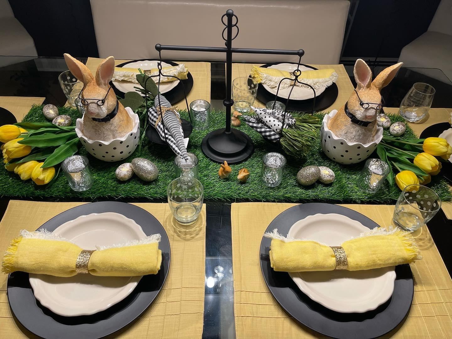 Full Easter tablescape with bunny centerpieces, tulips, and yellow napkins