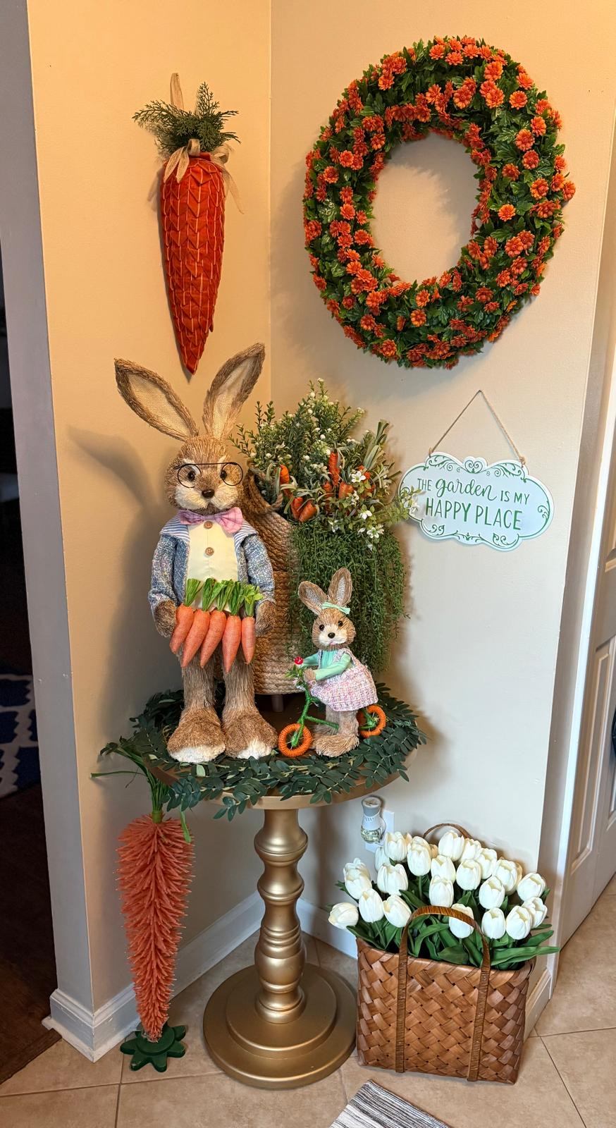 Spring corner display with a carrot wall hanging, floral wreath, and tulip basket