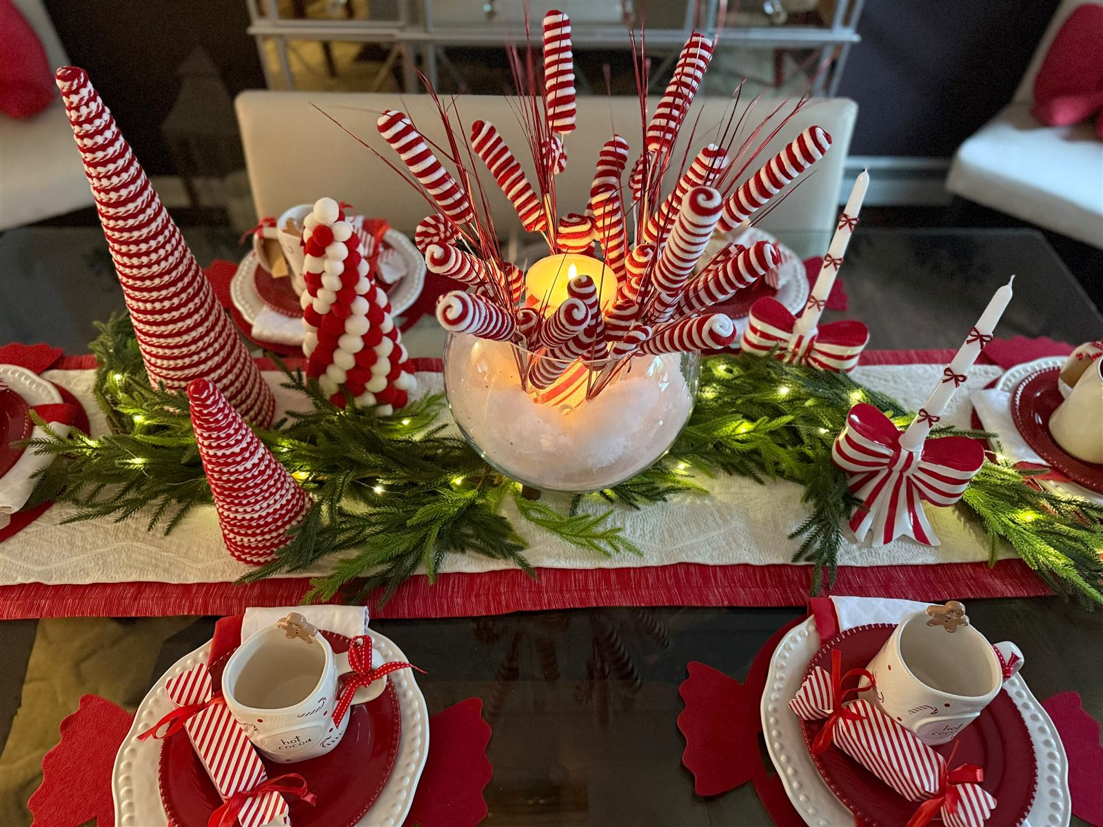 Red and white candy cane centerpiece with a candle