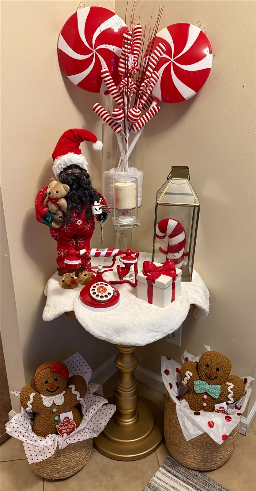 Santa figurine display corner with peppermint ornaments and gingerbread