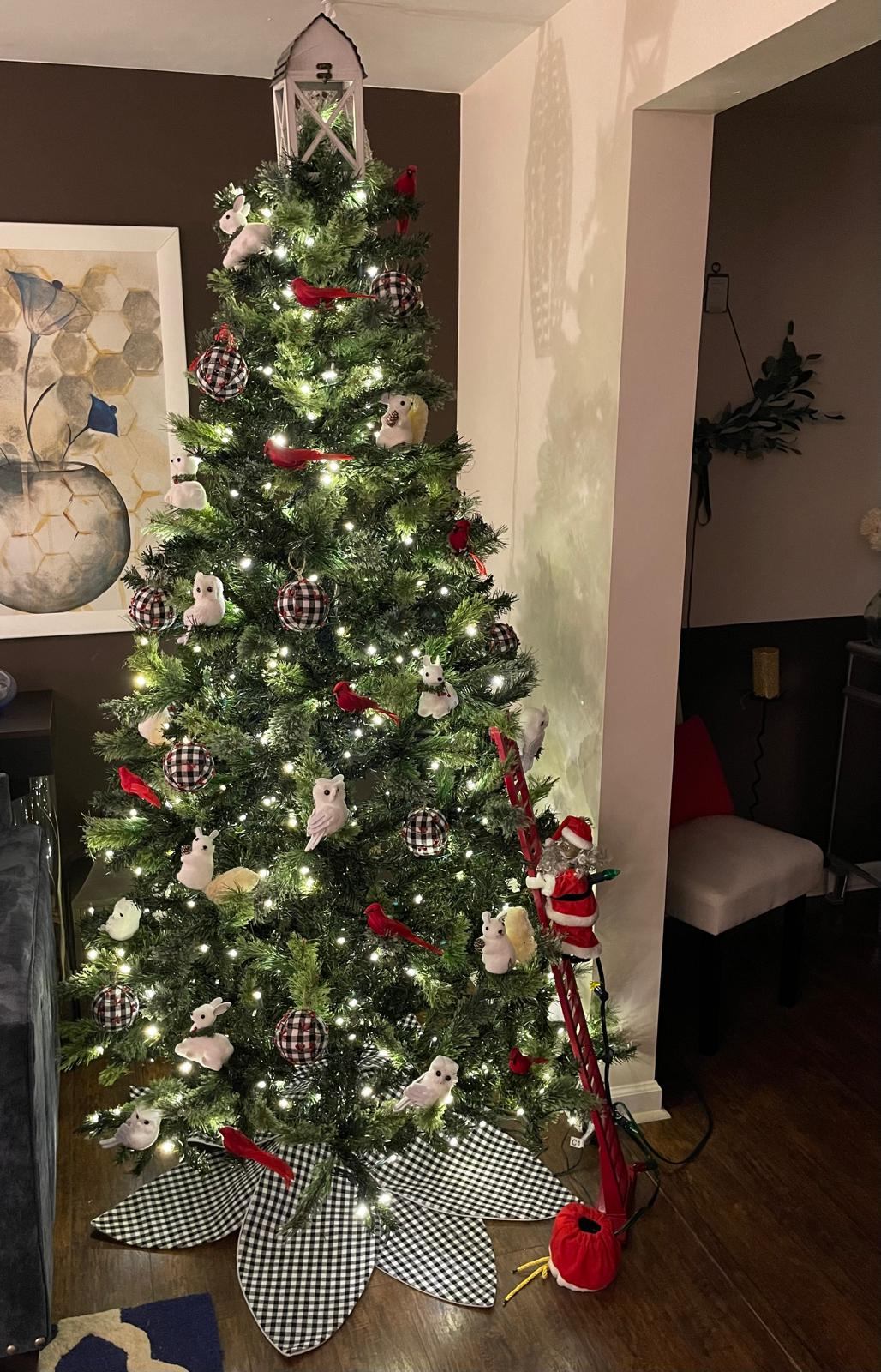 Christmas tree decorated with buffalo check ornaments, owls, bunnies, and cardinals